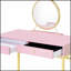 Élégant bureau de coiffeuse Coleen avec miroir et plateau à bijoux, combinant glamour et rangement pratique pour une expérience luxueuse.