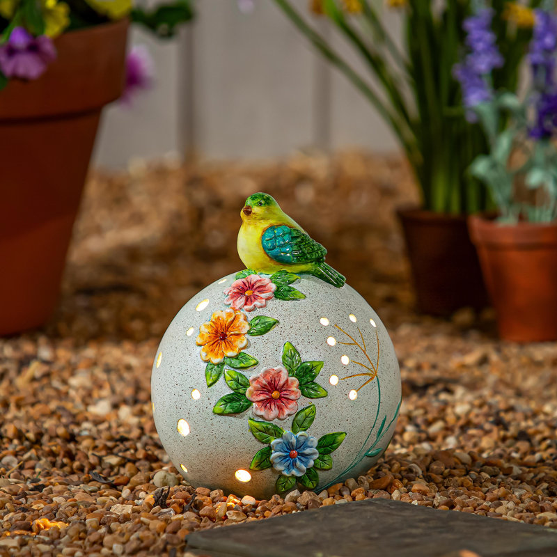 Statue solaire oiseau assis sur un orbe floral, H 8 po