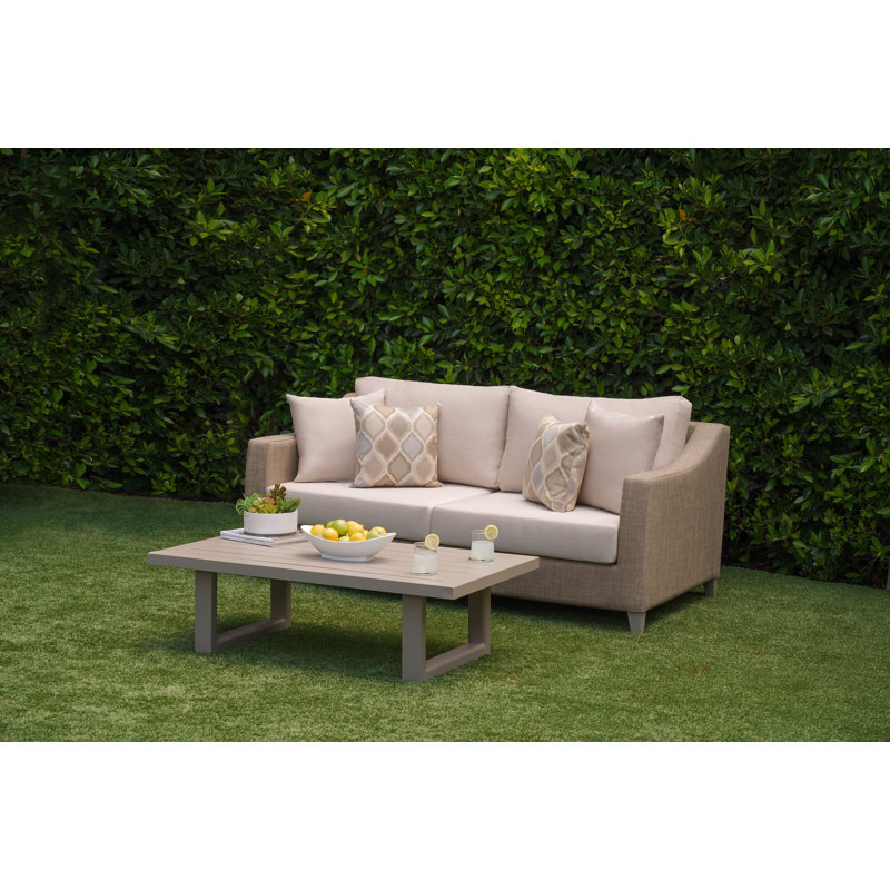Canapé d'extérieur Charlien 71 et table basse avec coussins Sunbrella
