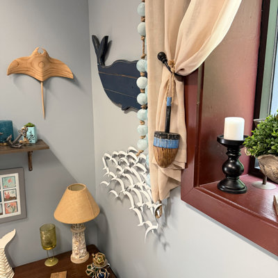 Coastal nautical wood buoy wall sculpture with blue stripe and rope hanger, 15 inches high