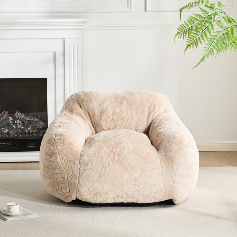 Fauteuil d'intérieur de style fauteuil beige, silhouette structurée, grand soutien, rembourrage en mousse personnalisé, idéal pour les petits appartements en mousse déchiquetée adaptative, matériau doux, favorise l'assise, convient
