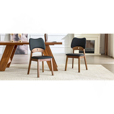 2 Walnut Colored Solid Wood Dining Chairs, With Black Pu Soft Packaging On The Backrest And Seat Cushion, Hollowed Out Design Backrest, For Home Dining Chairs.