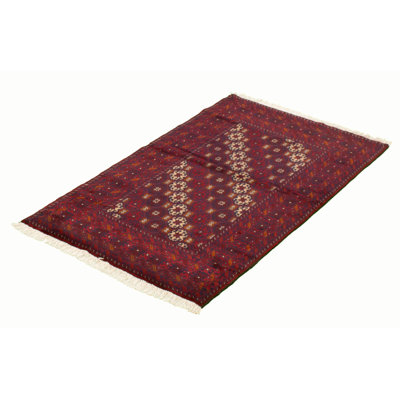 Tapis rouge foncé en laine noué à la main