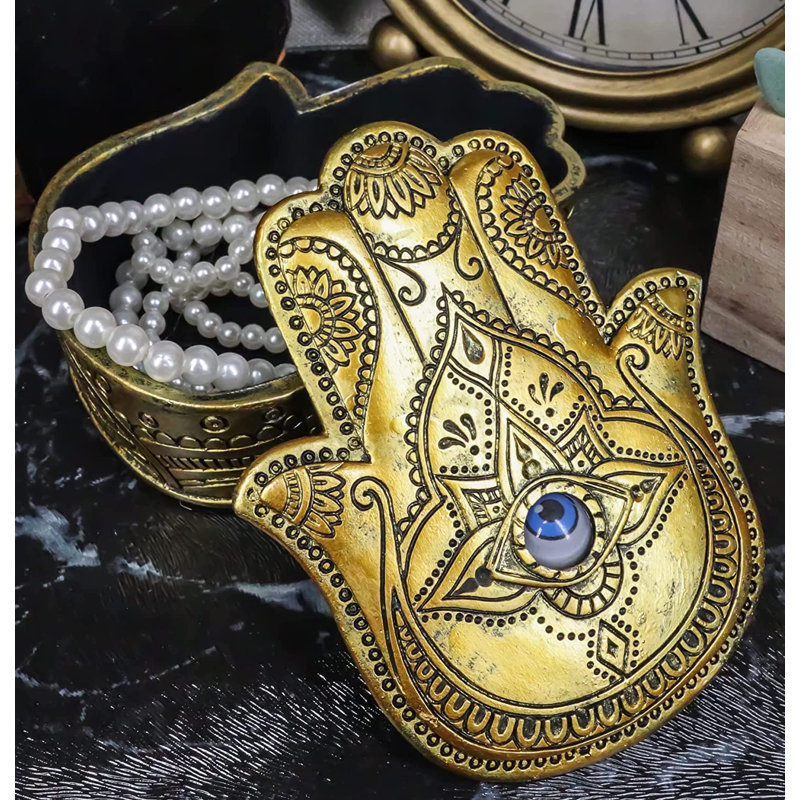Auspicieuse main dorée en forme de paume de Hamsa qui évite de rouler le mauvais œil
