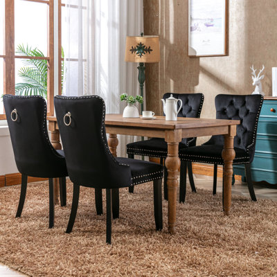 Chaises de salle à manger rembourrées en velours noir avec pieds en bois d'hévéa massif, garniture cloutée, coussin en mousse haute densité et confort