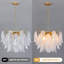 Lustre suspendu à 3 niveaux en verre soufflé blanc tourbillonnant, avec structure en métal doré, idéal pour salle à manger ou salon.-2043368848