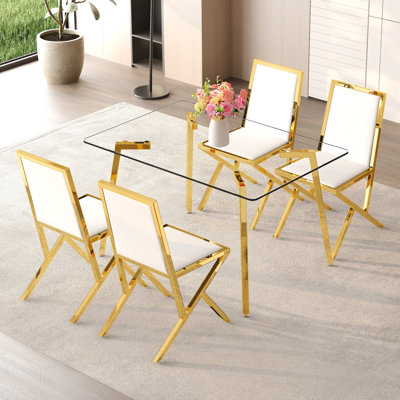 Ensemble de table et de chaises Table de salle à manger de 51 x 31,5 pouces en verre trempé, jumelée à un ensemble de 4 chaises de salle à manger en polyuréthane blanc. Ensemble de table et de chaise de restaurant moderne et luxueux.