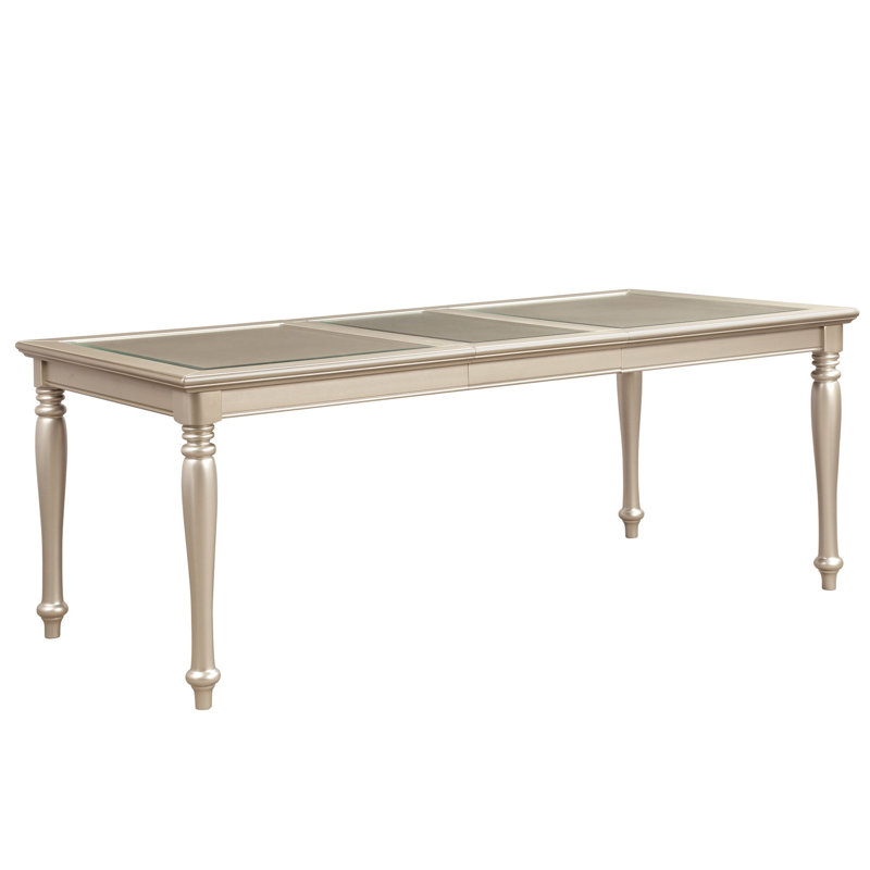 Table de salle à manger glamour à finition argentée avec insert en verre et rallonge réglable