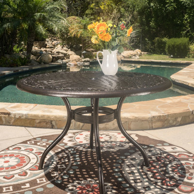 48-Inch Round Patio Dining Table Cast In Aluminum With Hammered Bronze Finish, Tabletop , Umbrella Hole, And Curved Legs, For Summer Meals Outdoor 48-In Crafted From Bronze, Tabletop, Back