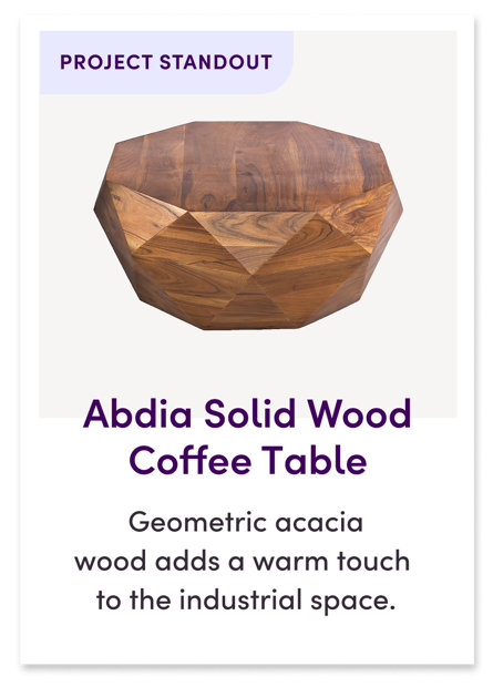 Abdia Solid Wood Coffee Table Geometric acacia wood adds unexpected contrast to the rest of the space's simple silhouettes.