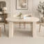 Table de salle à manger ovale extensible pour 4 à 8 personnes, finition inspirée du travertin avec piètement en bois, idéale pour les salons familiaux