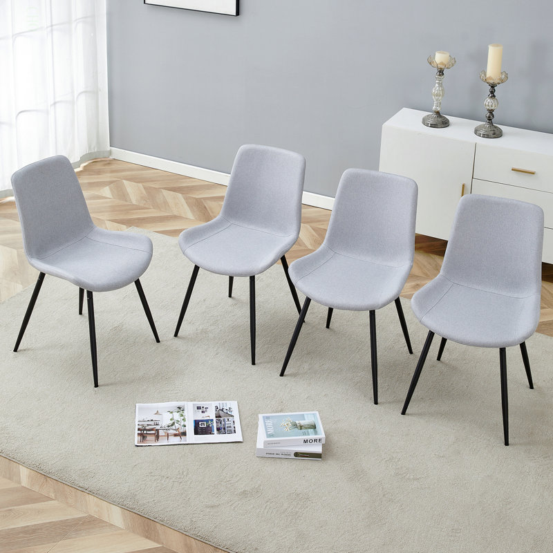 Ensemble confortable de chaises de salle à manger en lin et coton - siège et dossier intégrés en quatre pièces, matériau en lin et coton, conception de coussin incurvé élargi pour plus de confort.