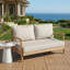 Causeuse de patio en bois d'acacia avec coussin beige résistant à l'eau