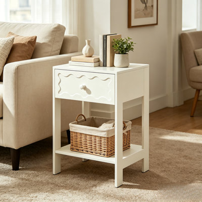 A White Modern-Style Single-Drawer Bedside Table With Fashionable Wavy Decorations And An Open Storage Shelf, Suitable For Small Spaces In Various Settings, Such As Living Rooms And Bedrooms