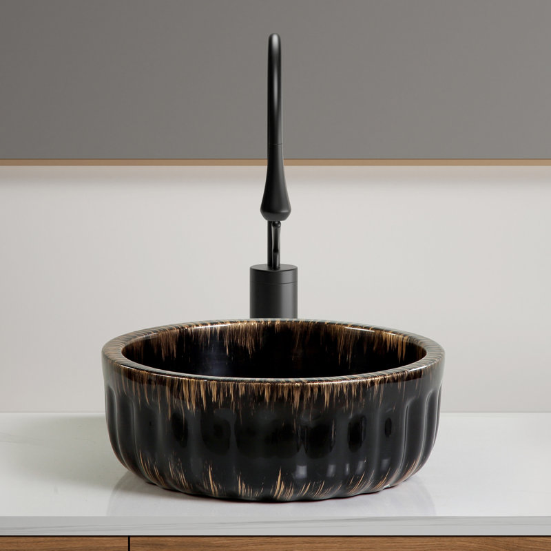 Lavabo de salle de bain noir en céramique durable, conception de vasque moderne, idéal pour les espaces compacts