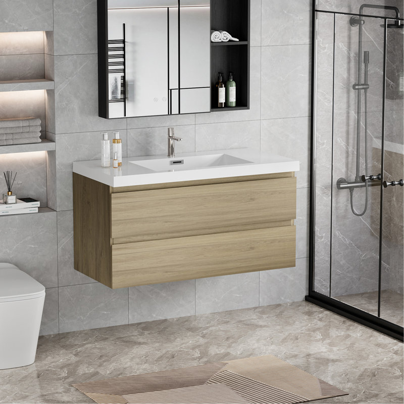 Meuble-lavabo flottant avec lavabo, mural et peu encombrant, idéal pour la conception et l'organisation de salles de bain modernes.
