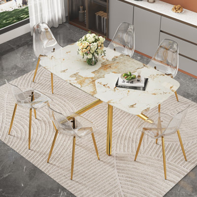 Ensemble de table de salle à manger luxueux à motif de marbre avec chaises en métal doré