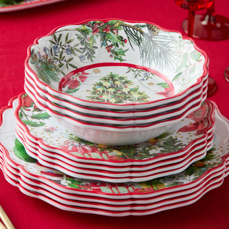 Service de table en mélamine 12 pièces du Père Noël - Trois couverts complets en mélamine richement illustrée, apportant la chaleur d'un livre de Noël à chaque table.