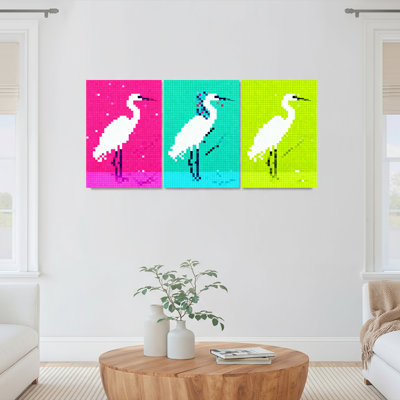 Ensemble de 3 tableaux muraux en toile tendue représentant un héron en pixel art, pour la décoration du salon, de la chambre et de la maison.