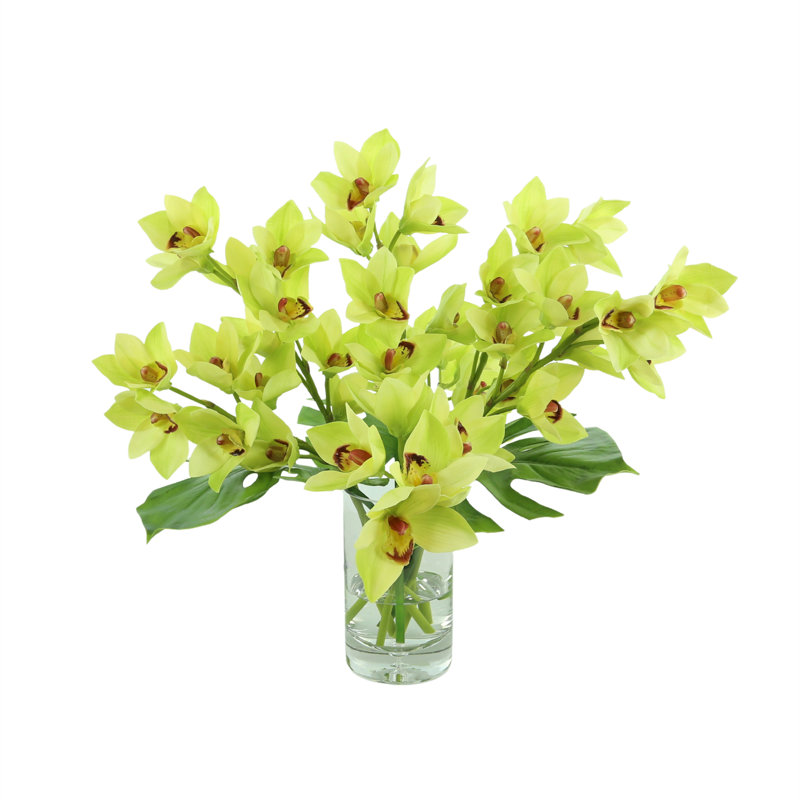 Orchids And Leaves In A Glass Vase