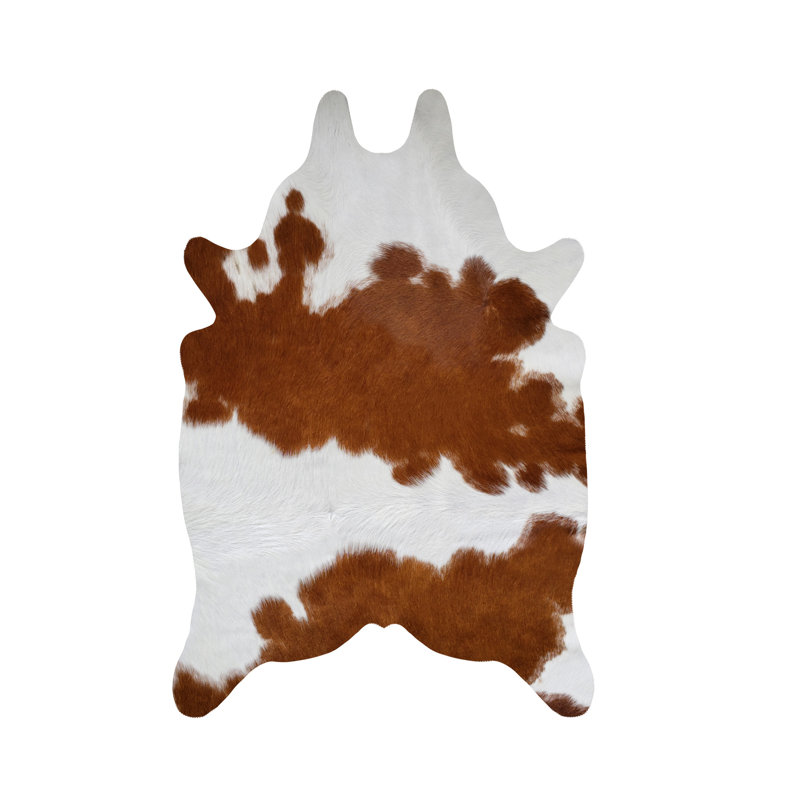 Tapis brun et blanc en cuir de vache