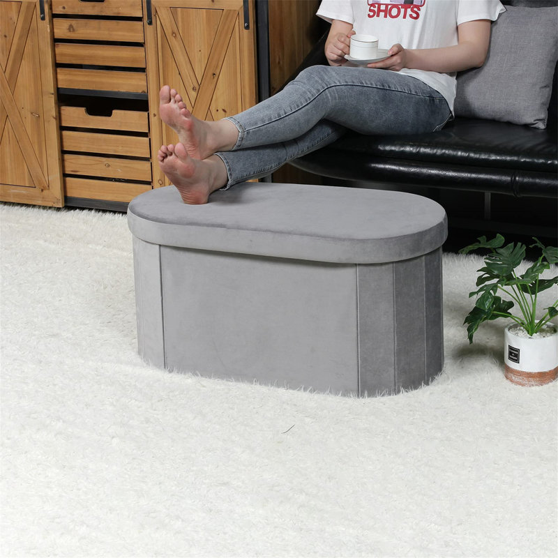 Voegele 76cm Wide Oval Solid Colour Ottoman with Storage, Grey