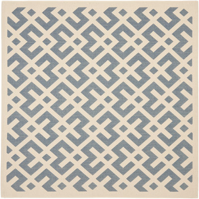 Tapis intérieur / extérieur bleu / blanc à motif géométrique Arneshia