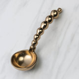 Set Of 4 Gold Beaded Handle Spoons