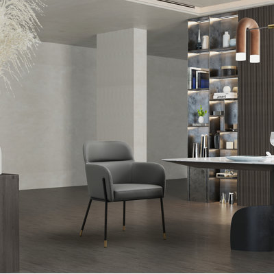 Fauteuil capitonné en acier