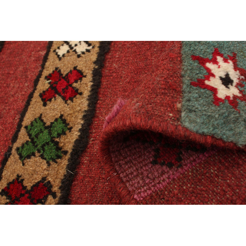 Tapis rouge foncé en laine noué à la main