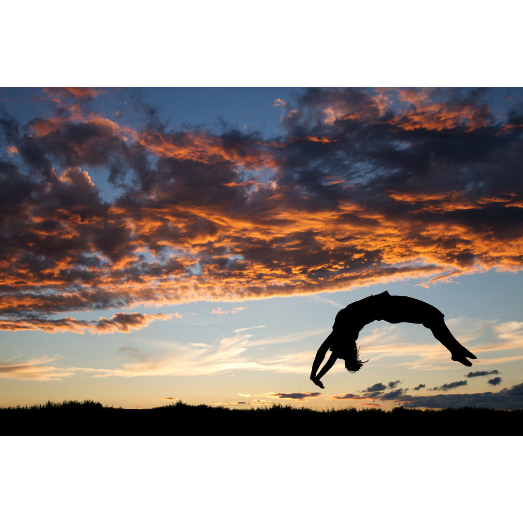 Leinwandbild Gymnast in Sunset Doing a Back Handspring