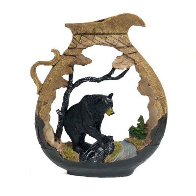 Figurine ours noir dans une cruche