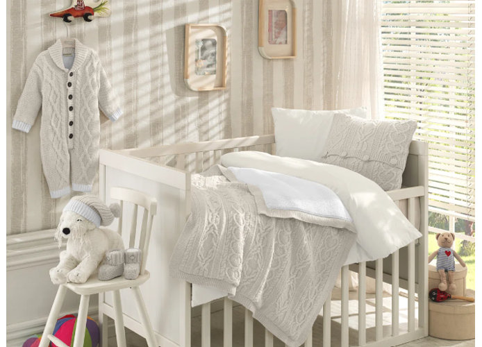 ivory cable-knit crib bedding set with matching pillow and blanket