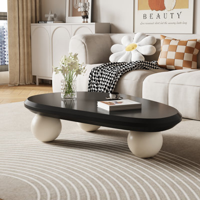 Table basse moderne ovale de 51 pouces, couleur crÃ¨me, noir et brun, avec trois pieds ronds