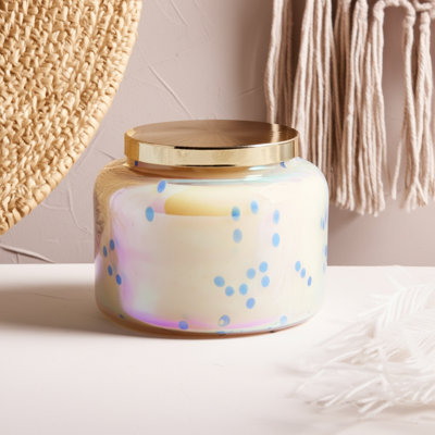 Bougie décorative en cire de verre dans un contenant à couvercle en métal avec un style moderne Boho Glam et un design élégant et irisé