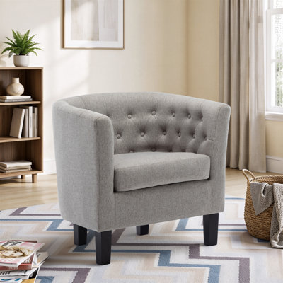 Fauteuil demi-tonneau capitonné avec pieds en bois