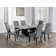 Shilynn Rectangular Dining Table In Engineered Stone And Black