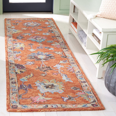 Kalja Hand Tufted Wool/Cotton Oriental Rug in Rust/Blue