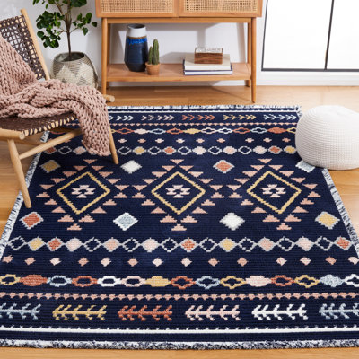 Baston Southwestern Navy/Orange/White Area Rug