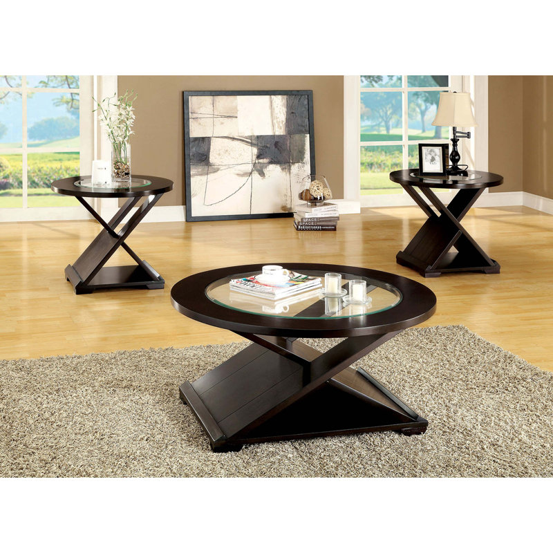 Table basse d'appoint de style contemporain avec base unique en forme de croix et plateau en verre de 5 mm soutenu par une structure en bois massif