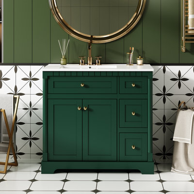 Ce meuble-lavabo moderne de 36 po avec comptoir pour salle de bain comprend une tablette réglable, des portes à fermeture douce, 3 tiroirs et un tiroir basculant