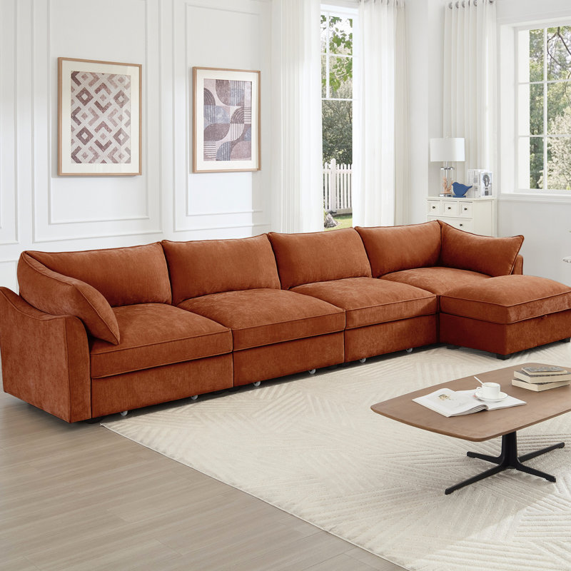 4 sièges orange en chenille avec dossier modulaire et accoudoirs escamotables, avec coussins enveloppants et tiroirs de rangement