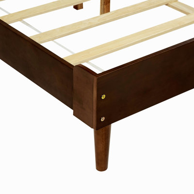 Lit en bois avec tête de lit tapissier
