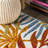 Manor Tropics Palm Leaves Cream/Orange Indoor/Outdoor Rug-1824123255