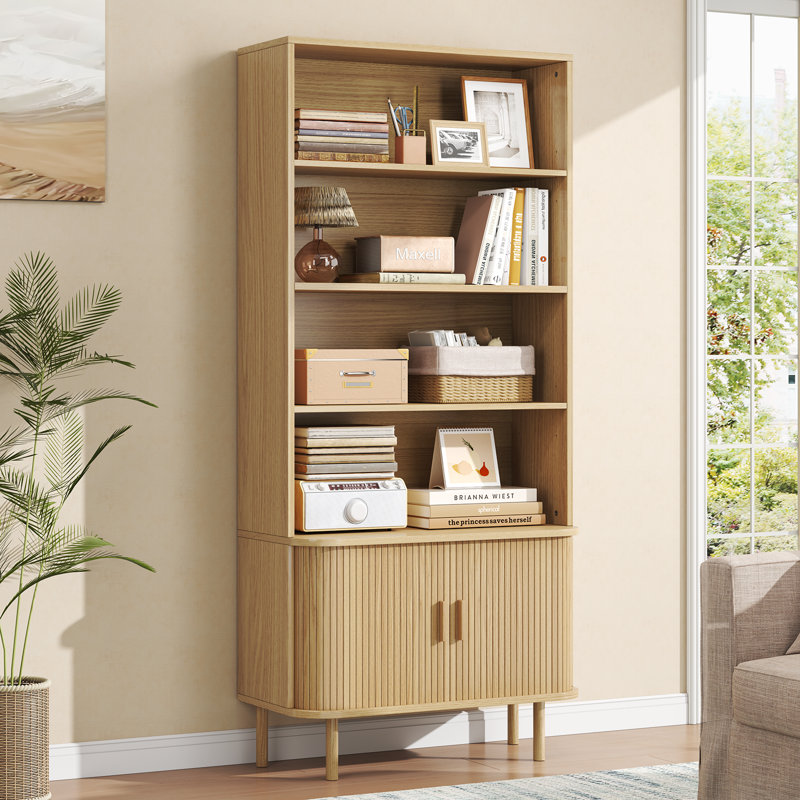 tall bookshelf with storage for a warm minimalist apartment