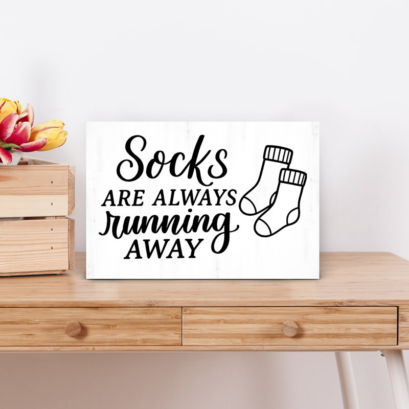 Socks Running Away by Imperfect Dust - Wrapped Canvas Print, 30.48cm H x 45.72cm W
