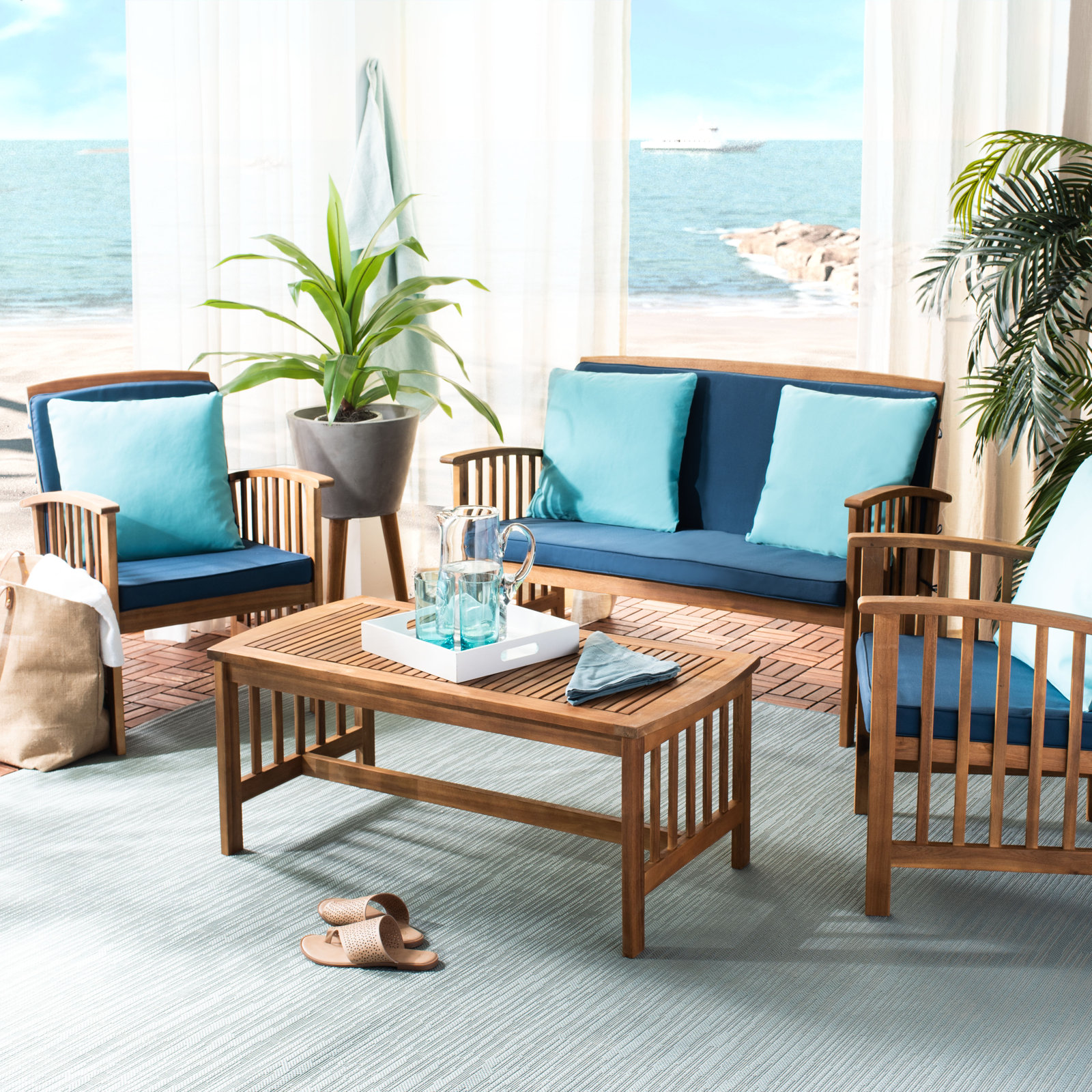 Delosreyes 4-Person Acacia Patio Seating Group, Turquoise Toss Pillow Color/Navy Cushion