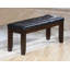 Banc moderne avec siège d'aspect cuir capitonné, pieds en bois fuselés, meubles de chambre à coucher, finition cerisier