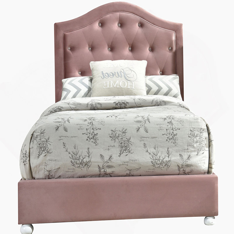 Lit tapissier rose capitonné