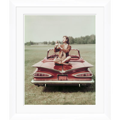 Vogue Magazine, "Sitting On A Chevrolet Convertible," John Rawlings, November 1, 1958 Print by John Rawlings